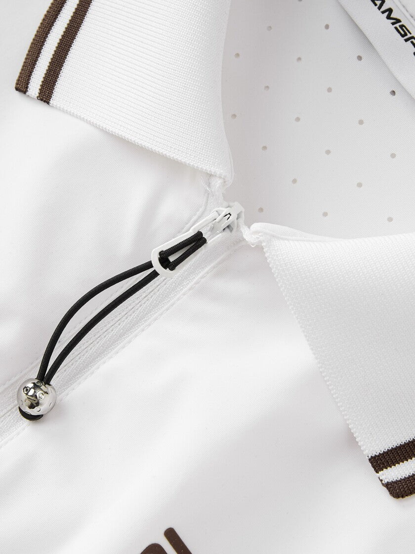 Closer look of Ramsports serve zip crop polo in white, focusing on the zipper and collar part