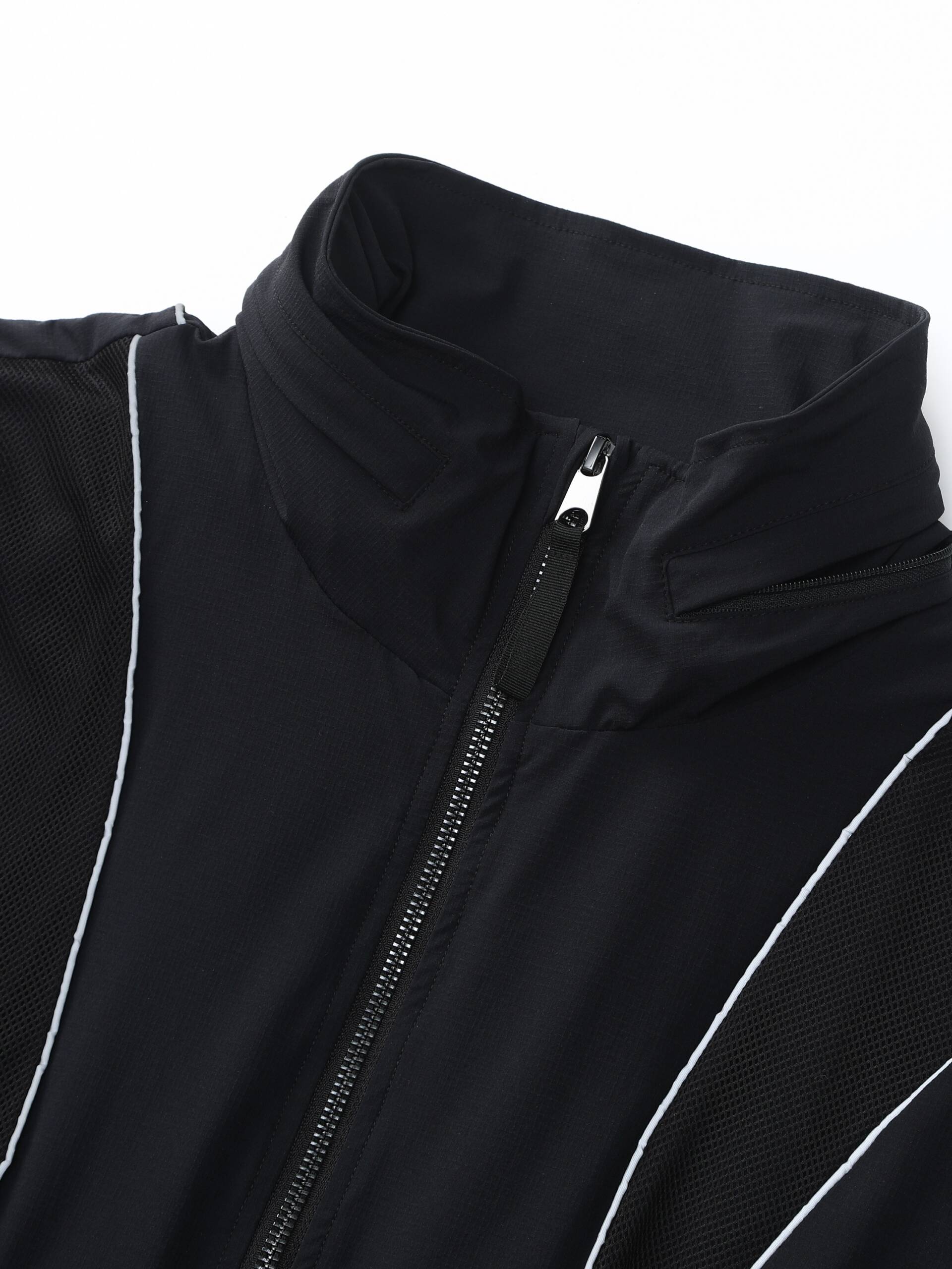 Zoomed-in image showing the zipper detail of the black Ramsports FlexTek Block Jacket