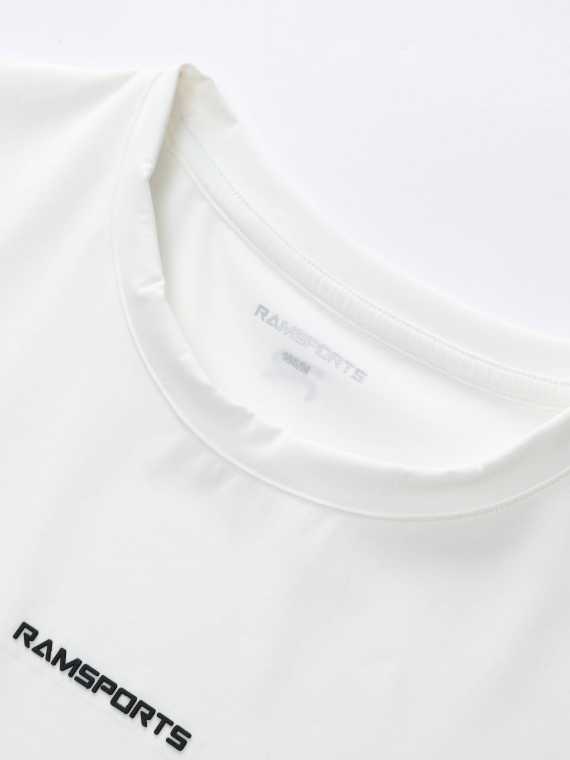 Close-up of the collar area showing the Ramsports logo design on the white Ramsports FlexTek Motion Tee