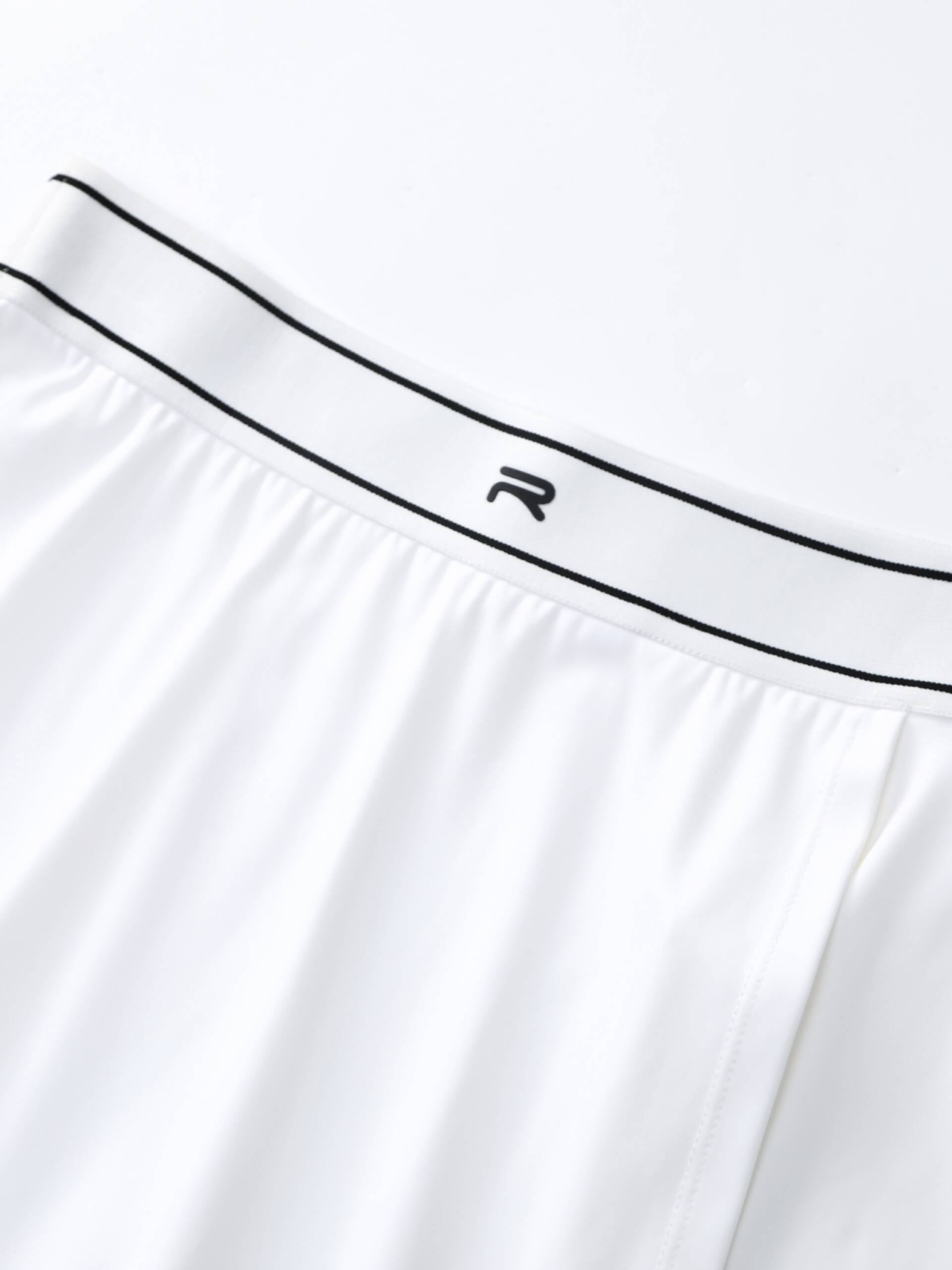 Zoomed-in image showing the Ramsports logo on the white FlexTek Sport Skort