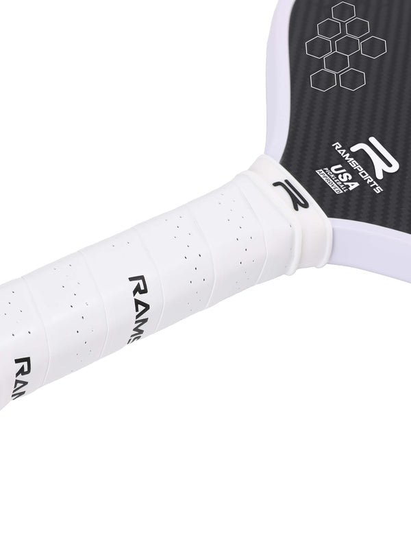 Close-up image of the area between the paddle face and handle of the Ramsports Infinite Pro Pickleball Paddle, focusing on the white Ramsports logo near the handle