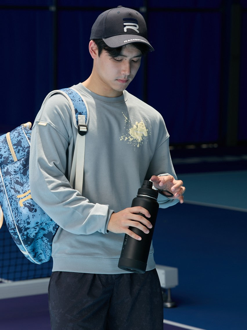male model in gray long sleeve opening his Ramsports Black Tumbler