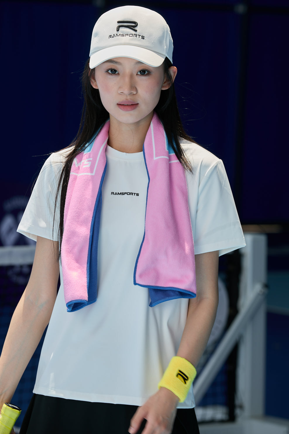 Asian female model with a pink Ramsports Pickleball Towel draped around her neck