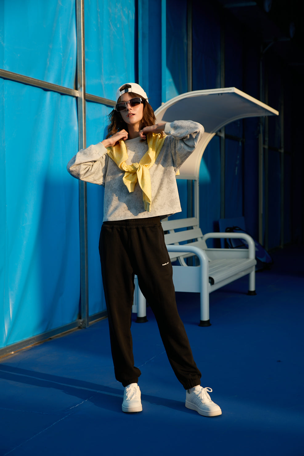 female model in Ramsports EcoSoft Everyday Jogger in black and gray longsleeves