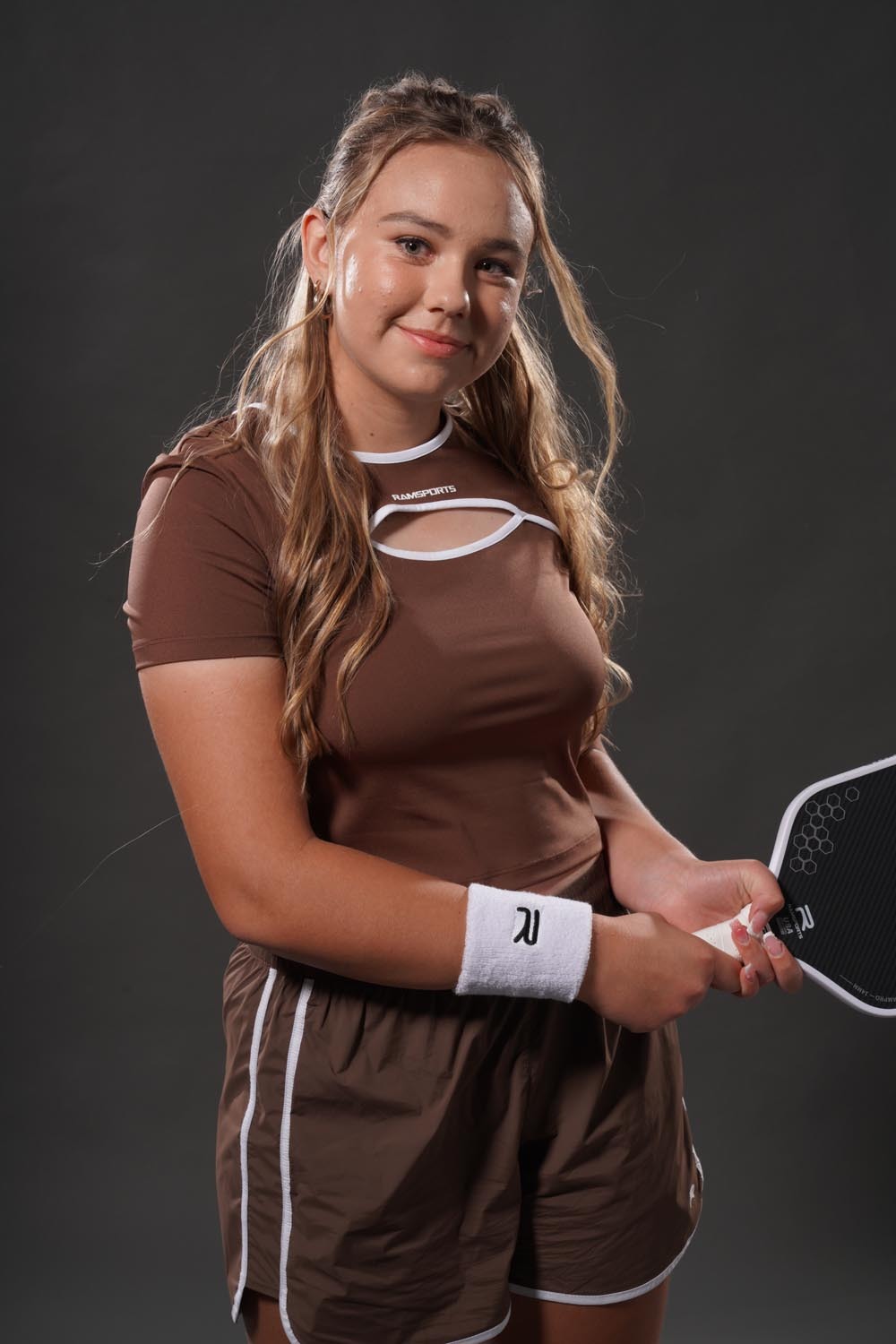 Nicola Schoeman wearing the brown Ramsports ArcBand Crew Tee