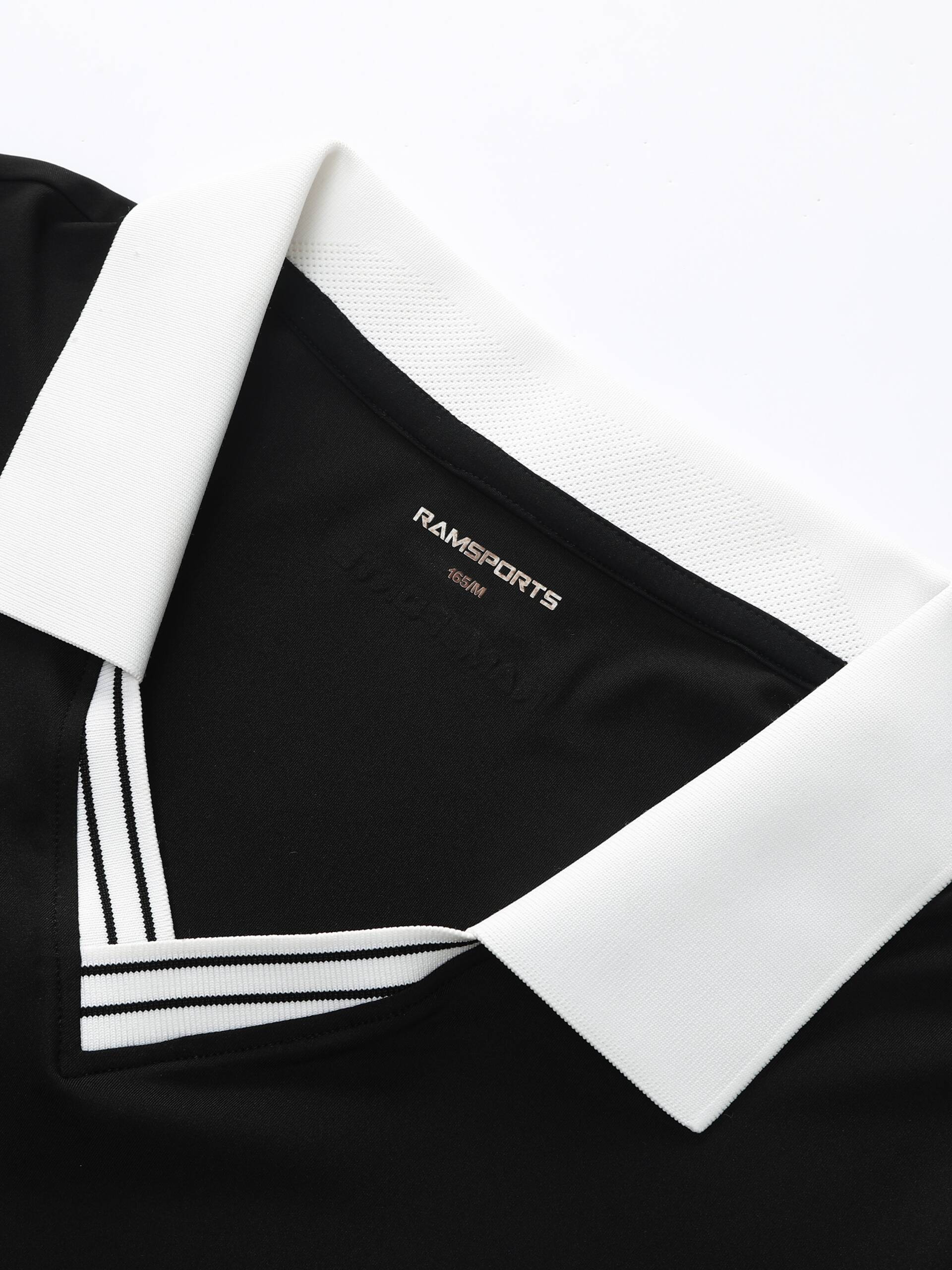 Close-up of the white collar area on the black Ramsports AirFlow V-Neck Polo, highlighting the visible logo design