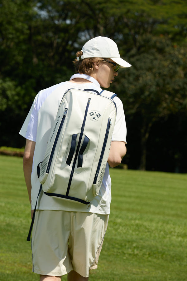 Male model wearing the Ramsports Light Court Luxe Tot bag with one strap over his shoulder