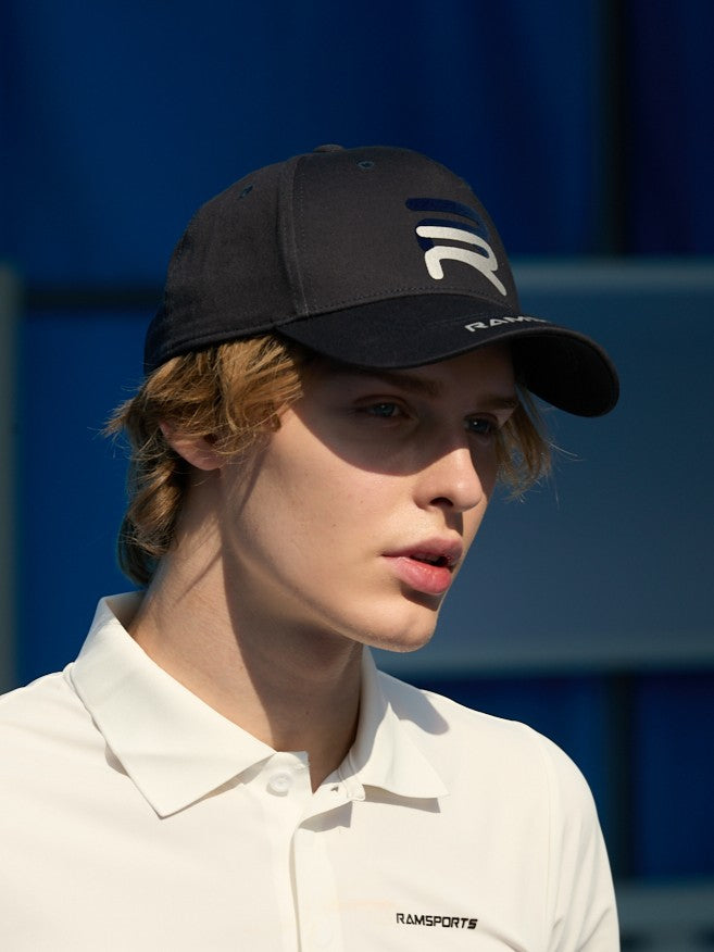 close image of a male model wearing the black Ramsports Sport Cap
